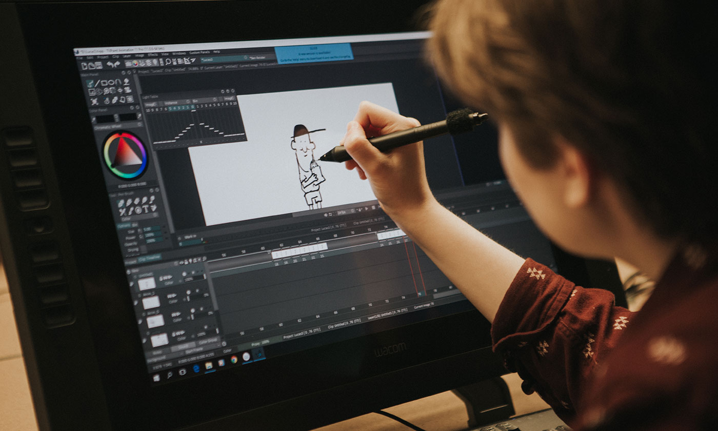 student drawing on a digital screen